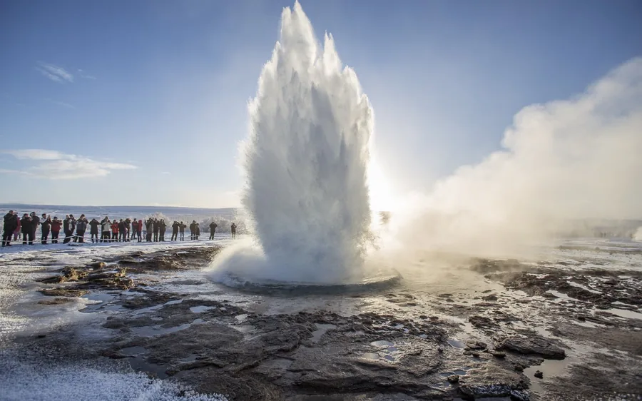 A crowd watching Strokkur erupt in the Haukadalur geothermal field